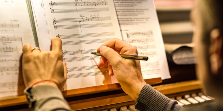 Person Writing A Score